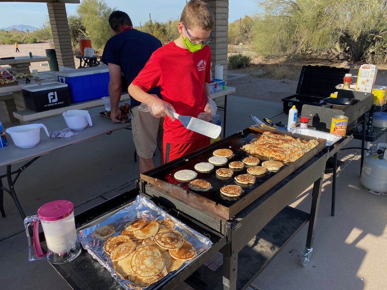 Scout cooking breakfast