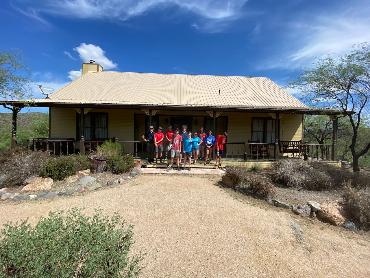 Planning crew in front of ranch house