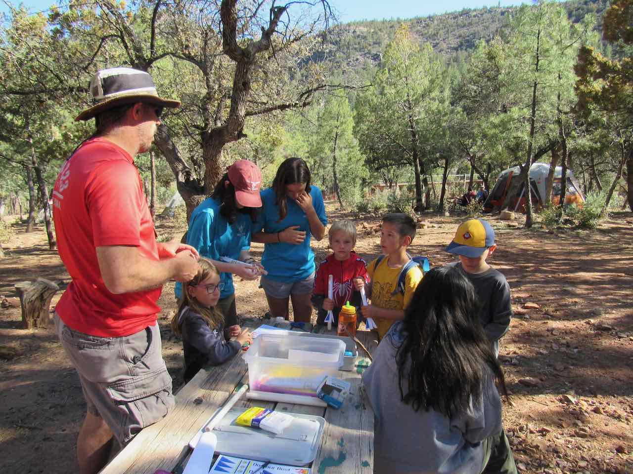 Scout making paper rockets